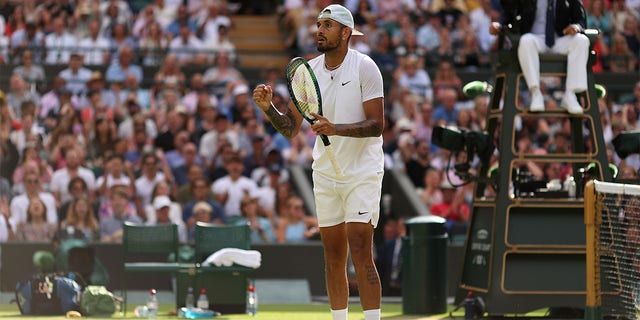 Nick Kyrgios of Australia reacts after winning match point against Cristian Garin of Chile during their Men's Singles Quarter Final match on day ten of The Championships Wimbledon 2022 at All England Lawn Tennis and Croquet Club on July 6, 2022 in London, England. 