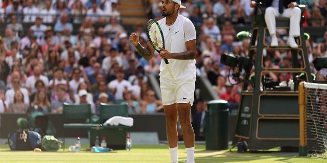 Nick Kyrgios of Australia reacts after winning match point against Cristian Garin of Chile during their Men's Singles Quarter Final match on day ten of The Championships Wimbledon 2022 at All England Lawn Tennis and Croquet Club on July 6, 2022 in London, England.
