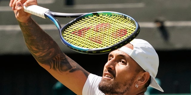 Nick Kyrgios returns to Brandon Nakashima on day eight of the Wimbledon championships in London, Monday, July 4, 2022.