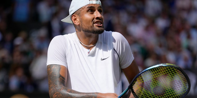 Australia's Nick Kyrgios argues with the umpire about the noise in the crowd during the final of the men's singles against Serbia's Novak Djokovic on day fourteen of the Wimbledon tennis championships in London, Sunday, July 10, 2022. 