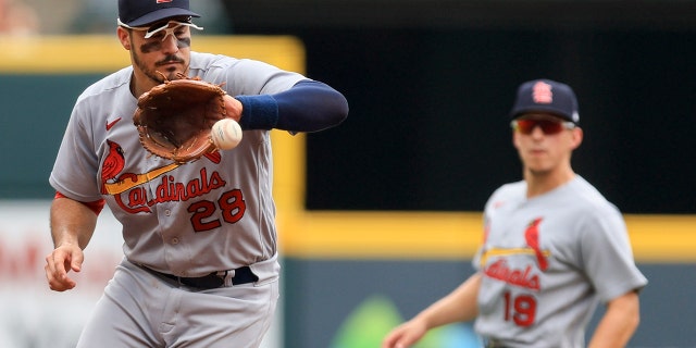 St. Louis Cardinals' Nolan Arenado fields the ball hit by Cincinnati Reds' Kyle Farmer for an out during the second inning of a baseball game in Cincinnati, Sunday, July 24, 2022.