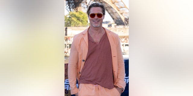 Pitt sported a head-to-toe orange ensemble during a photo call in Paris for "Bullet Train."