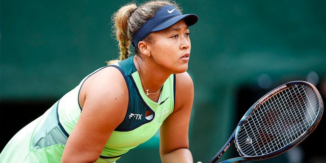 Naomi Osaka plays against Amanda Anisimova during the French Open at Roland Garros on May 23, 2022 in Paris.