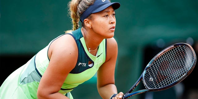 Naomi Osaka plays against Amanda Anisimova during the French Open at Roland Garros on May 23, 2022 in Paris.