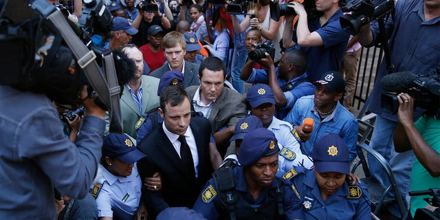 Oscar Pistorius leaving court Sept. 12, 2014, after he is acquitted of murder and convicted of culpable homicide.
