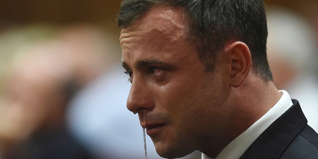 Oscar Pistorius weeping after Judge Thokozile Mapisa cleared him of murder charges in the North Gauteng High Court in Pretoria Sept. 11, 2014.