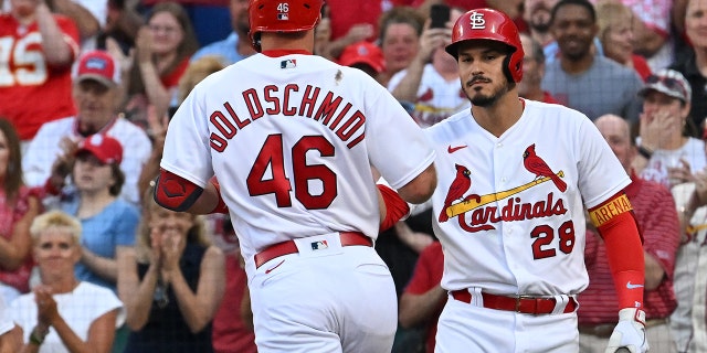 St. Louis Cardinals third baseman Nolan Arenado (28) performed a solo home run during a match against the Miami Marlins at Busch Stadium in St. Louis on June 27, 2022, followed by teammate Paul Goldschmidt on the home plate. Congratulate (46).