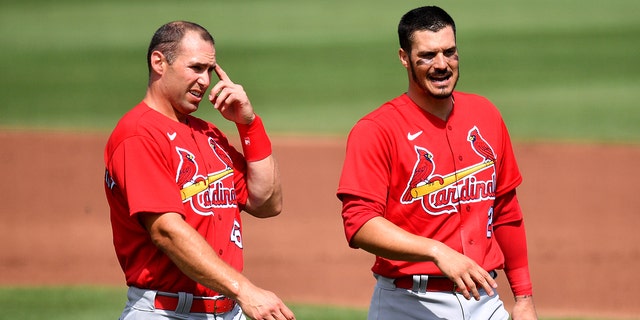 Paul Goldschmid, #46, and Nolan Arenado, #28, of the St. Louis Cardinals wait for their hats and gloves in the middle of the second inning against the St. Louis Cardinals at the Spring Training game at Roger Dean Chevrolet Stadium on March 02, 2021 Jupiter , in Florida.