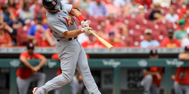 Paul Goldschmidt of the St. Louis Cardinals hits a single home run during the sixth inning of a baseball game against the Cincinnati Reds in Cincinnati, Sunday, July 24, 2022. 