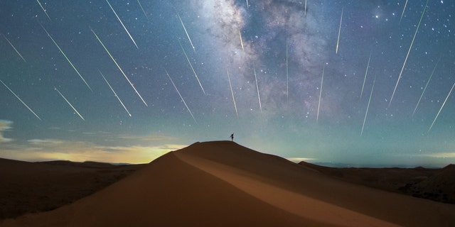 INNER MONGOLIA, CHINA - AUGUST 17, 2021 - The Perseid meteor shower is seen over the Tengger Desert in North China's Inner Mongolia Autonomous Region, Aug. 17, 2020. 