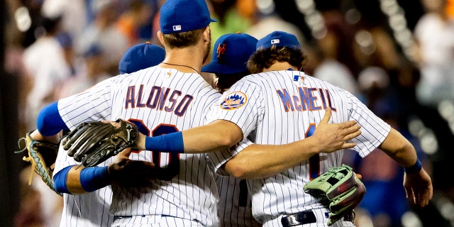 New York Mets' first baseman Pete Alonso and second baseman Jeff McNeil celebrate with teammates following their 8-5 victory against the San Diego Padres, Sunday, July 24, 2022, in New York.