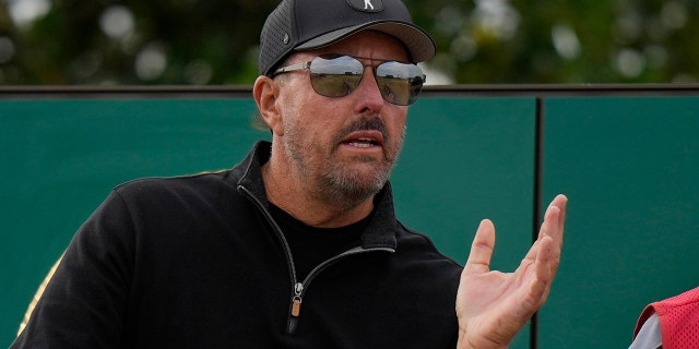 Phil Mickelson of the US prepares to play from the 3rd tee during the first round of the British Open golf championship on the Old Course at St. Andrews, Scotland, Thursday, July 14 2022.