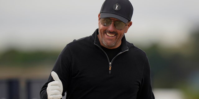 Phil Mickelson, of the U.S., gestures as he leaves the 3rd tee during the first round of the British Open golf championship on the Old Course at St. Andrews, Scotland, Thursday, July 14 2022.