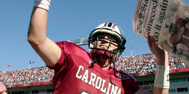 FILE - South Carolina quarterback Phil Petty celebrates after defeating Ohio State at the Outback Bowl on January 1, 2002 in Tampa, Florida.