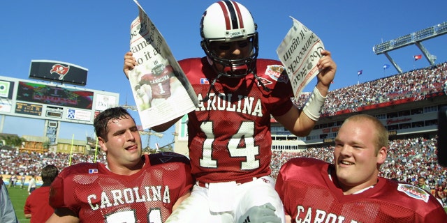 South Carolina quarterback Phil Petty (14) is carried off the field by teammates after beating Ohio State, 31-28, in the Outback Bowl at Raymond James Stadium in Tampa, Florida.