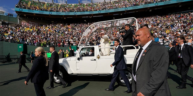 Pope Francis arrives to deliver an open air mass at Commonwealth Stadium, Tuesday, July 26, 2022, in Edmonton, Alberta. 