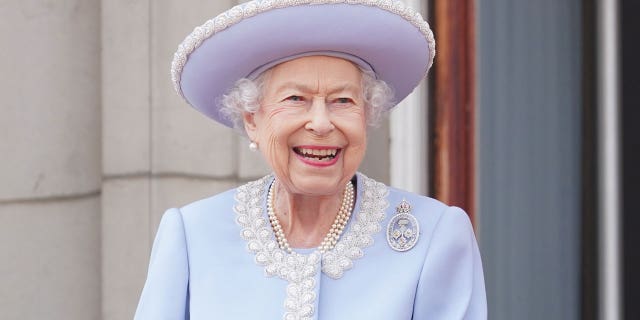 Queen Elizabeth II watches from the balcony of Buckingham Palace during the Trooping the Colour parade June 2, 2022, in London.