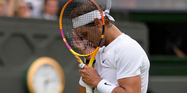 Rafael Nadal reacts after losing a point against Taylor Fritz during the Wimbledon championships in London, Wednesday, July 6, 2022.