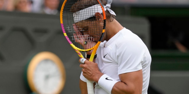 Rafael Nadal's reaction after losing a point to Taylor Fritz during the Wimbledon Championships in London, Wednesday, July 6, 2022.