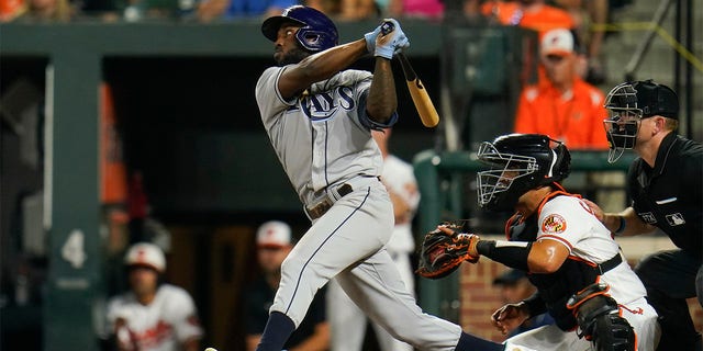 Tampa Bay Rays' Randy Arozarena connects for a two-run, bases loaded double off Baltimore Orioles relief pitcher Jorge Lopez during the 10th inning of a baseball game, Wednesday, July 27, 2022, in Baltimore.  Rays' Taylor Walls and Roman Quinn scored on the double.  The Rays won 6-4 in ten innings. 