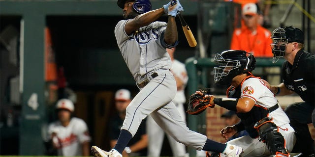 Tampa Bay Rays' Randy Arozarena connects for a two-run, bases loaded double off Baltimore Orioles relief pitcher Jorge Lopez during the 10th inning of a baseball game, Wednesday, July 27, 2022, in Baltimore. Rays' Taylor Walls and Roman Quinn scored on the double. The Rays won 6-4 in ten innings.