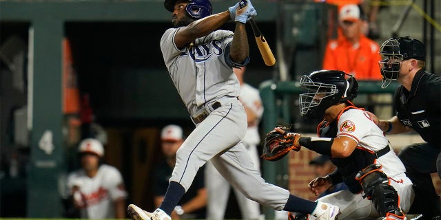 Tampa Bay Rays' Randy Arozarena connects for a two-run, bases loaded double off Baltimore Orioles relief pitcher Jorge Lopez during the 10th inning of a baseball game, Wednesday, July 27, 2022, in Baltimore.  Rays' Taylor Walls and Roman Quinn scored on the double.  The Rays won 6-4 in ten innings. 