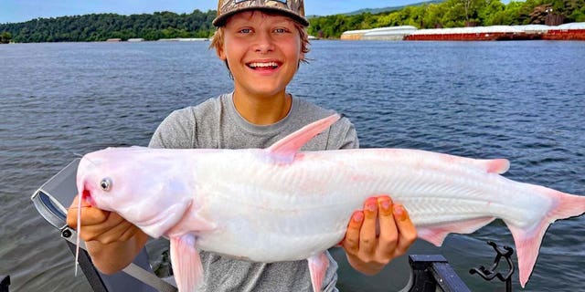 Edwards Tarumianz shows off his rare catch.