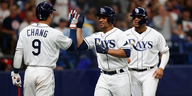 Francisco Mejia (center) of the Tampa Bay Rays celebrates with Ray Yuchan after playing against the Boston Red Sox in six baseball games on Tuesday, July 12, 2022 in St. Petersburg, Florida. 