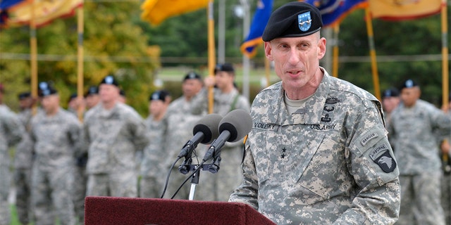 The 101st Airborne Division (Air Assault) "Screaming Eagles" commander US Army Maj.  Gen.  Gary Volesky speaks during a color casing ceremony at McAuliffe Hall, Fort Campbell, Ky., Oct.  14, 2014.