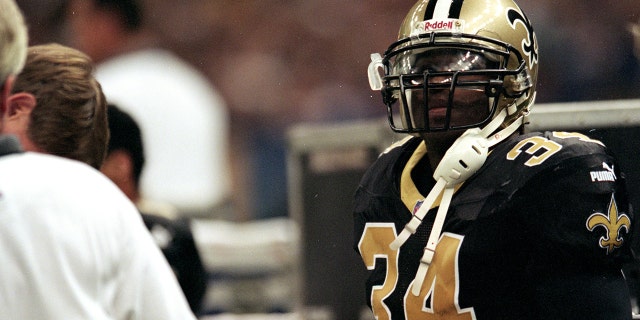 12 Sep 1999: Ricky Williams, #34 of the New Orleans Saints, sits on sidelines September 12, 1999 during the game against the Carolina Panthers at the Louisiana Superdome in New Orleans, Louisiana. The Saints defeated the Panthers 19-10.