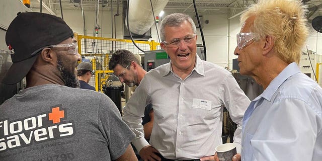 Republican Michigan gubernatorial candidate Kevin Rinke speaks with employees at Michigan Production Machining in Macomb County, Mich., Thursday, July 28, 2022.