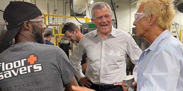 Republican Michigan gubernatorial candidate Kevin Rinke speaks with employees at Michigan Production Machining in Macomb County, Mich., Thursday, July 28, 2022.