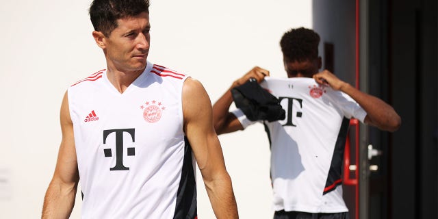 Robert Lewandowski of FC Bayern München walks onto the training pitch before a training session of FC Bayern München at Saebener Strasse training ground on July 15, 2022 in Munich, Germany.