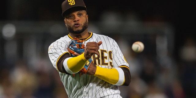 No. 24 Robinson Cano from the San Diego Padres field throws to first base after fielding in the seventh inning against the Milwaukee Brewers on May 23, 2022 at Petco Park in San Diego, California.