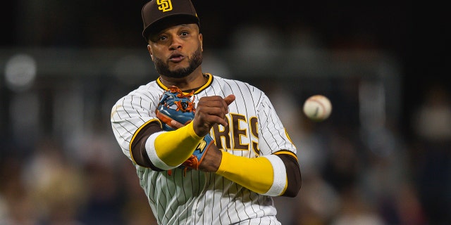 Robinson Cano # 24 from San Diego Padresfield throws the ball to first base after fielding the ball seven times against Milwaukee Brewers on May 23, 2022 at Petco Park, San Diego, California.