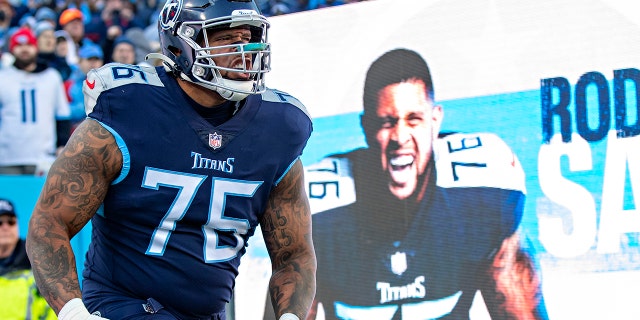 Rodger Saffold III of the Tennessee Titans runs onto the field during introductions before a game against the Cincinnati Bengals in an AFC divisional playoff game at Nissan Stadium Jan. 22, 2022, in Nashville.