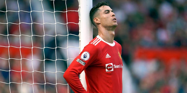 Manchester United's Cristiano Ronaldo rests against a goal post during an English Premier League soccer match between Manchester United and Norwich City at Old Trafford Stadium in Manchester, England on April 16, 2022.