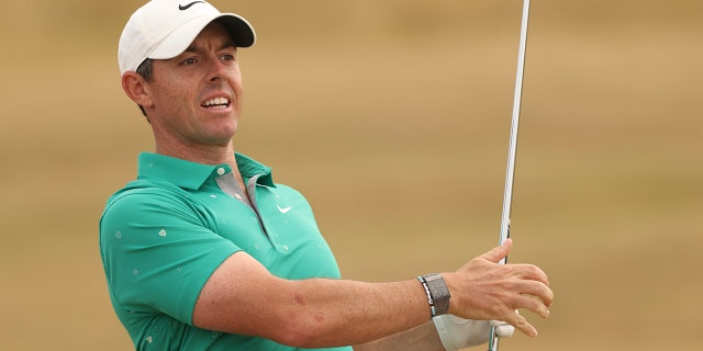 Northern Ireland's Rory McIlroy plays his shot on the fourth fairway during the third round of the British Open held at the Old Course in St Andrews, Scotland, 16 July 2022.