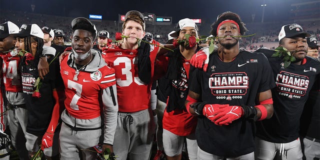 Ohio State Buckeyes players celebrate on the field after the Buckeyes defeated the Utah Utes 48 to 45 to win the Rose Bowl game played on January 1, 2022 at the Rose Bowl in Pasadena CA.