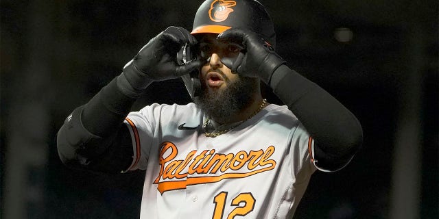 Baltimore Orioles' Rougned Odor gestures to teammates after hitting an RBI single against the Chicago Cubs during the eighth inning of a baseball game Wednesday, July 13, 2022, in Chicago.