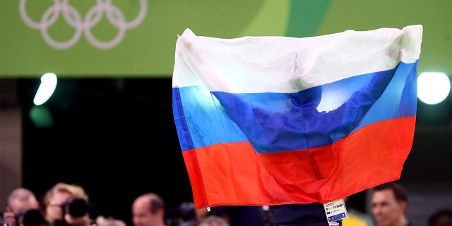 Aliya Mustafina of Russia celebrate winning the gold medal after the Women's Uneven Bars Final on Day 9 of the Rio 2016 Olympic Games at the Rio Olympic Arena on August 14, 2016 in Rio de Janeiro, Brazil.