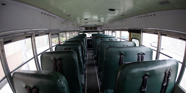 An empty school bus is pictured during a trailer through downtown Los Angeles to demand that lawmakers in Congress and California provide sufficient funding to ensure all students have the support they need for school distance learning and the eventual safe return to in-person classes during the outbreak of the coronavirus disease (COVID-19) in Los Angeles, California, U.S., August 13, 2020. REUTERS/Mike Blake