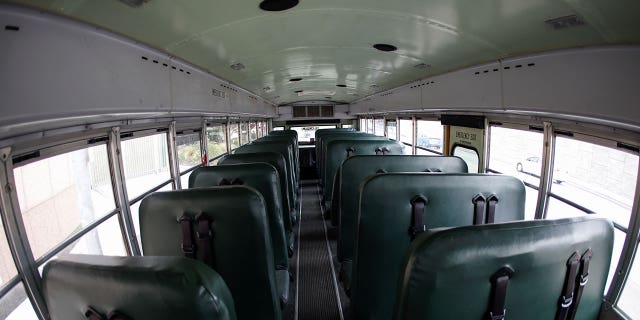 An empty school bus is pictured during a caravan through downtown Los Angeles to demand that Congress and California legislators provide sufficient funding to ensure all students have the support they need for distance learning and the eventual safe return to in-person classes during the outbreak of the coronavirus disease (COVID-19) in Los Angeles, California, U.S., August 13, 2020. REUTERS/Mike Blake