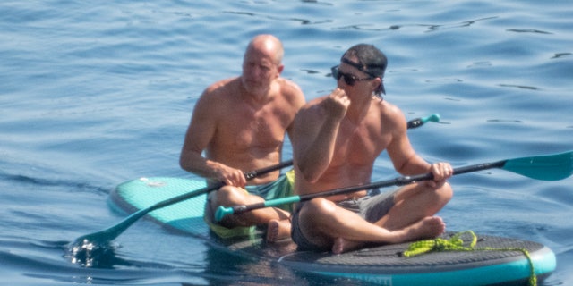 Matthew and Woody looked content while out in the middle of the ocean together on a family retreat.