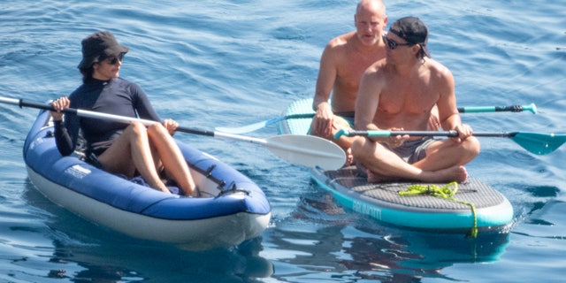 Matthew McConaughey's wife of 10 years, Camila Alves, dropped by to hang out with the guys, and paddled out in her own inflatable kayak.