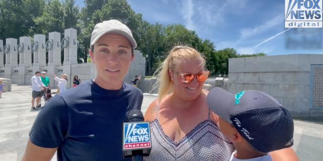 A family of three discusses why the loves the country while enjoying a day at the National Mall in Washington, D.C. (Fox News Digital/ Jon Michael Raasch)