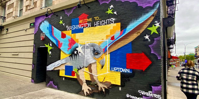 The northern half of Broadway slices through uptown Manhattan's now mostly Spanish-speaking neighborhoods, such as Washington Heights. This mural is located at the corner of Broadway and West 164th Street, 120 blocks north of Times Square.