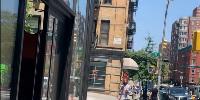 The man seen crossing an intersection in a screengrab from video.