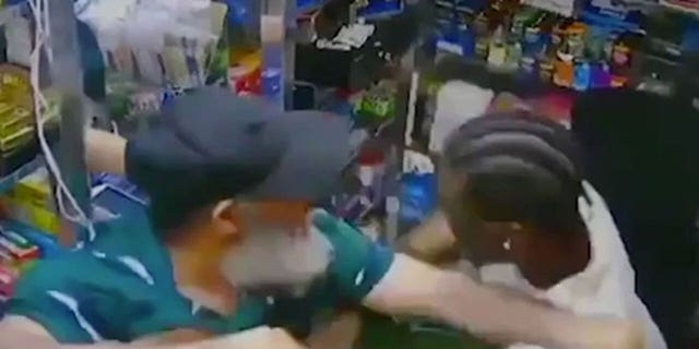 A screenshot from surveillance footage obtained by the New York Post, showing Jose Alba, 61, and Austin Simon tussling moments before Alba used a kitchen knife to stab him in the chest and neck.