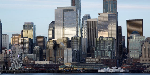 The Seattle skyline is pictured from a Washington State Ferry following a statement from ferry officials asking riders to consider staying in their vehicles when driving onboard and other steps to minimize coronavirus exposure in Seattle March 4, 2020. 